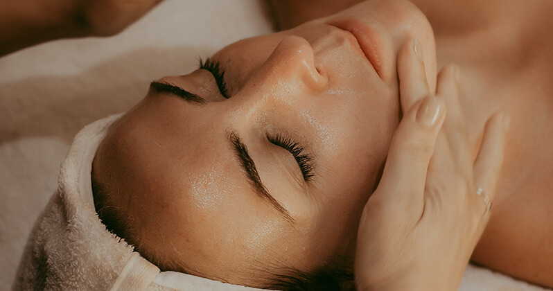 women with facial cream